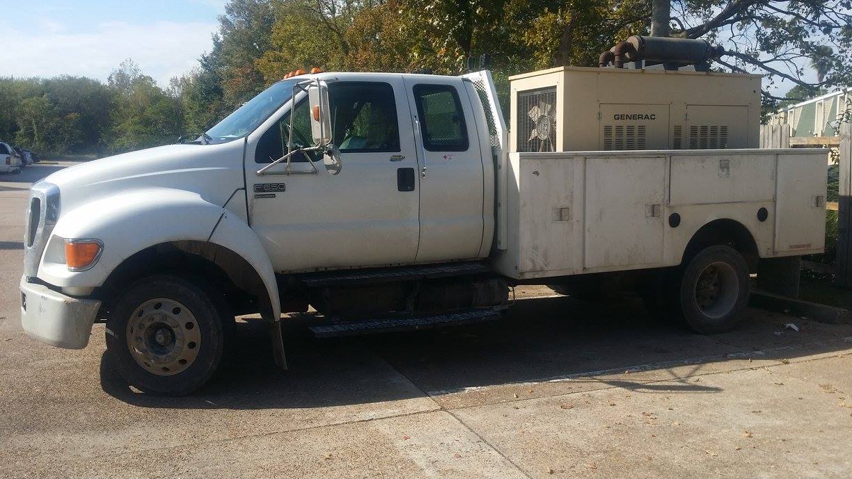 Service truck carrying generator