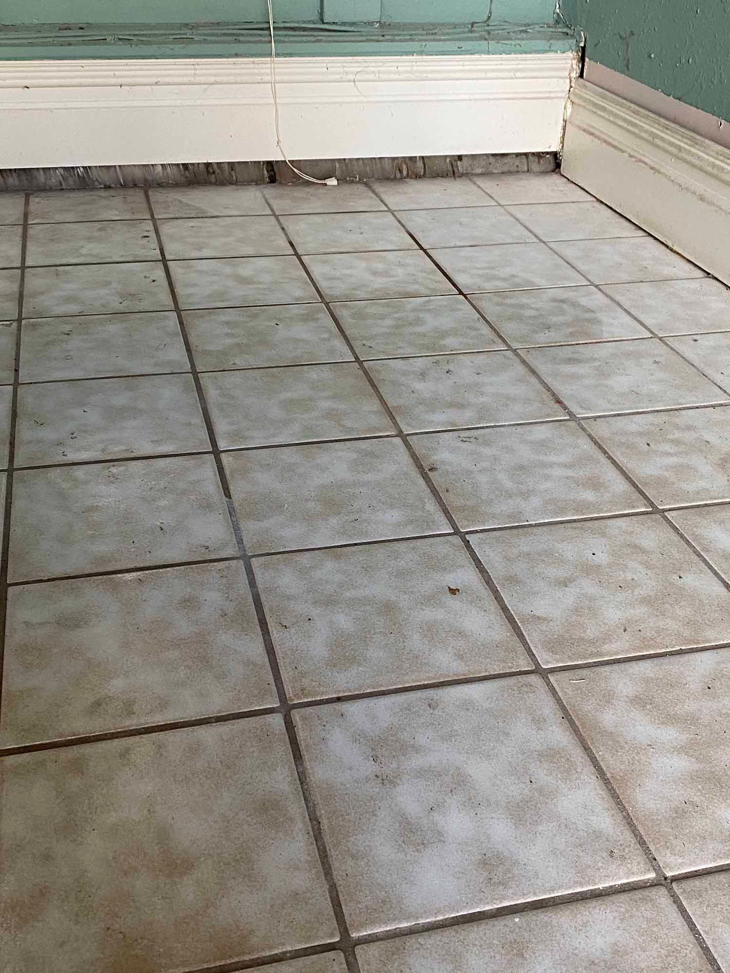 A close up of a tiled floor in a room.