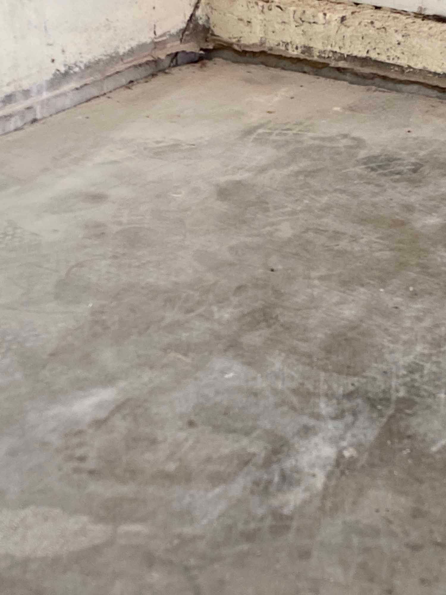 A close up of a concrete floor in a room.