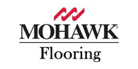 The Mohawk Flooring logo featuring red wave-like icons above the black text 