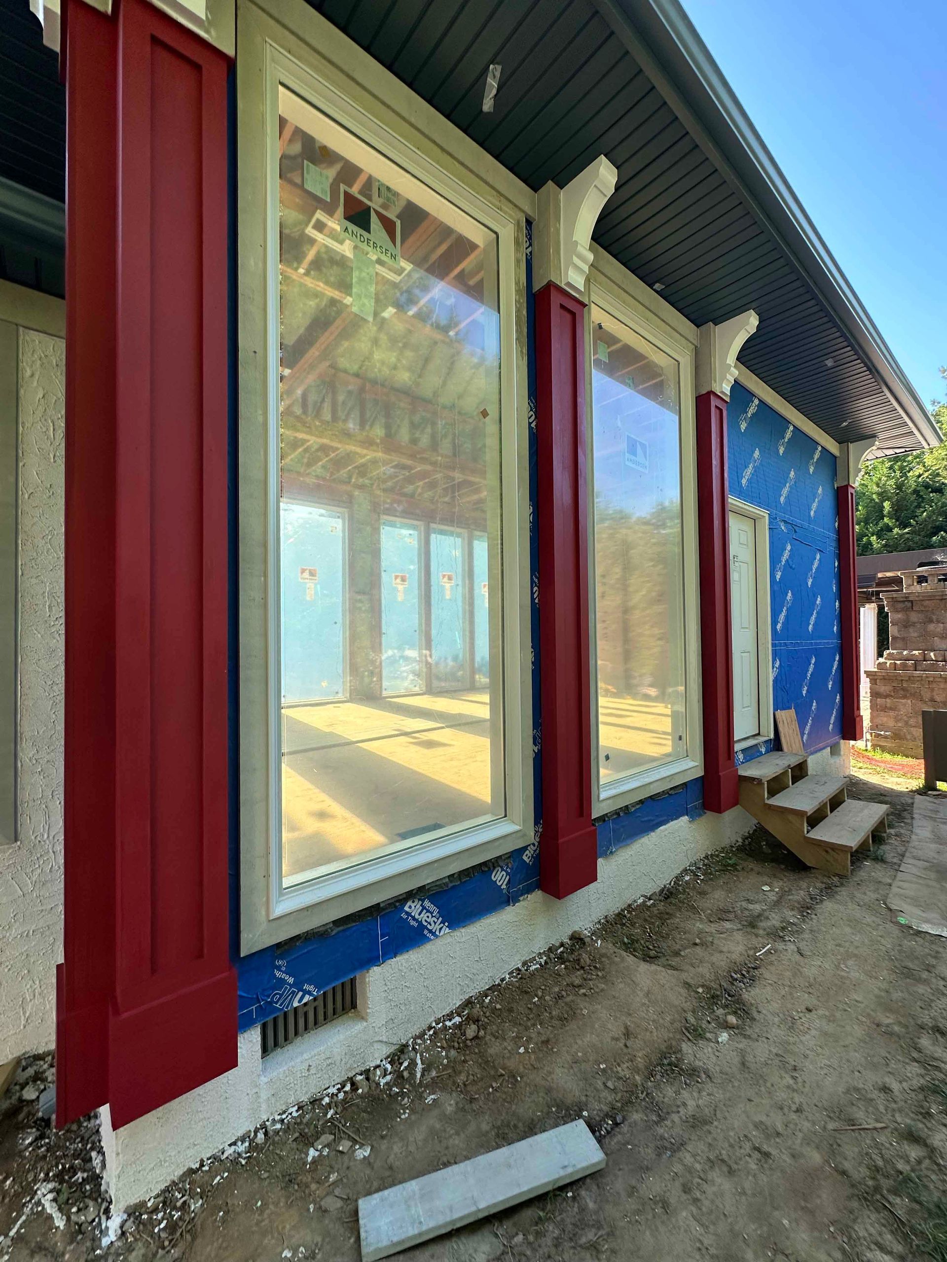 A red white and blue house with a lot of windows