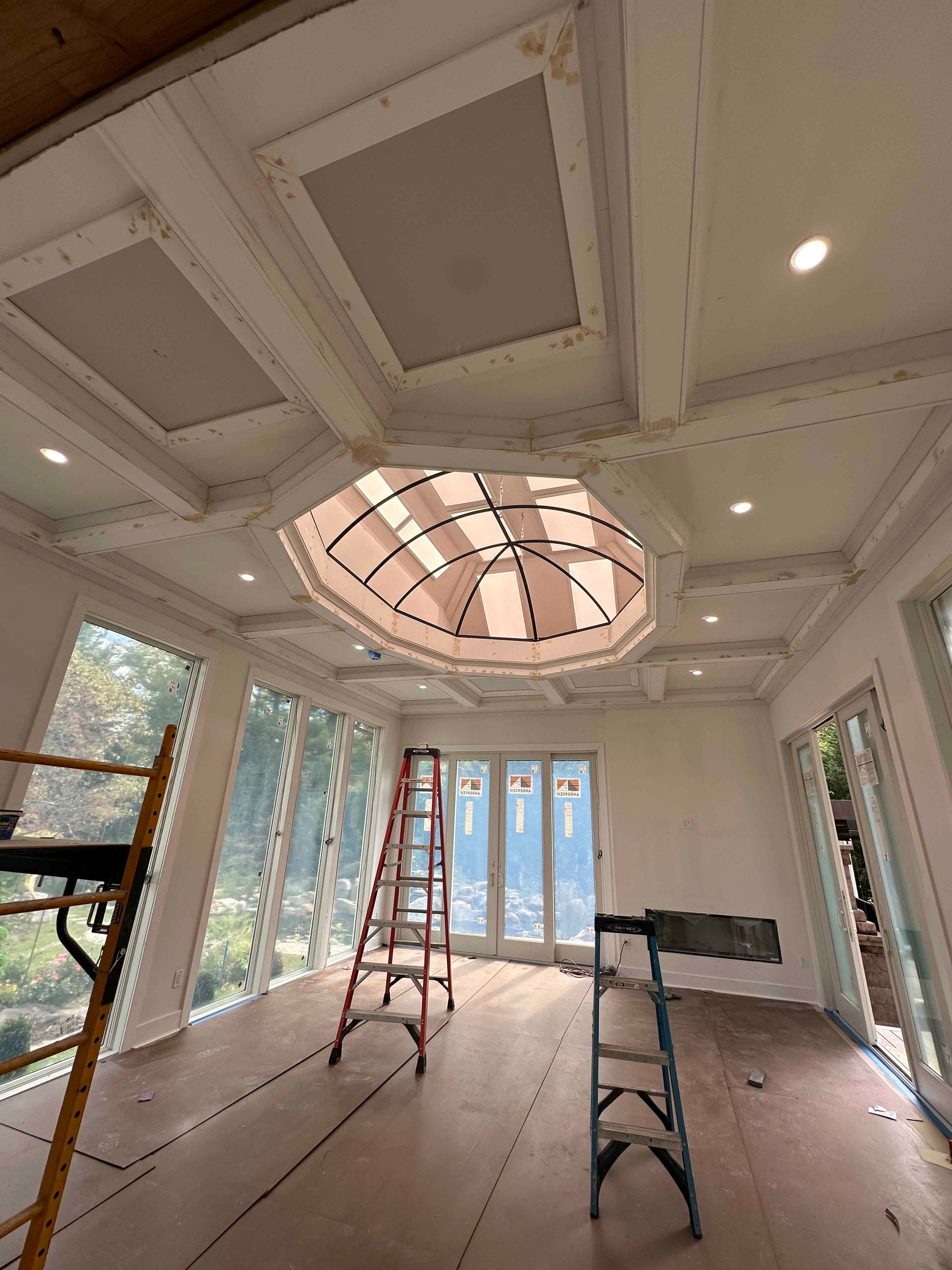 A room with a dome ceiling and a ladder in it