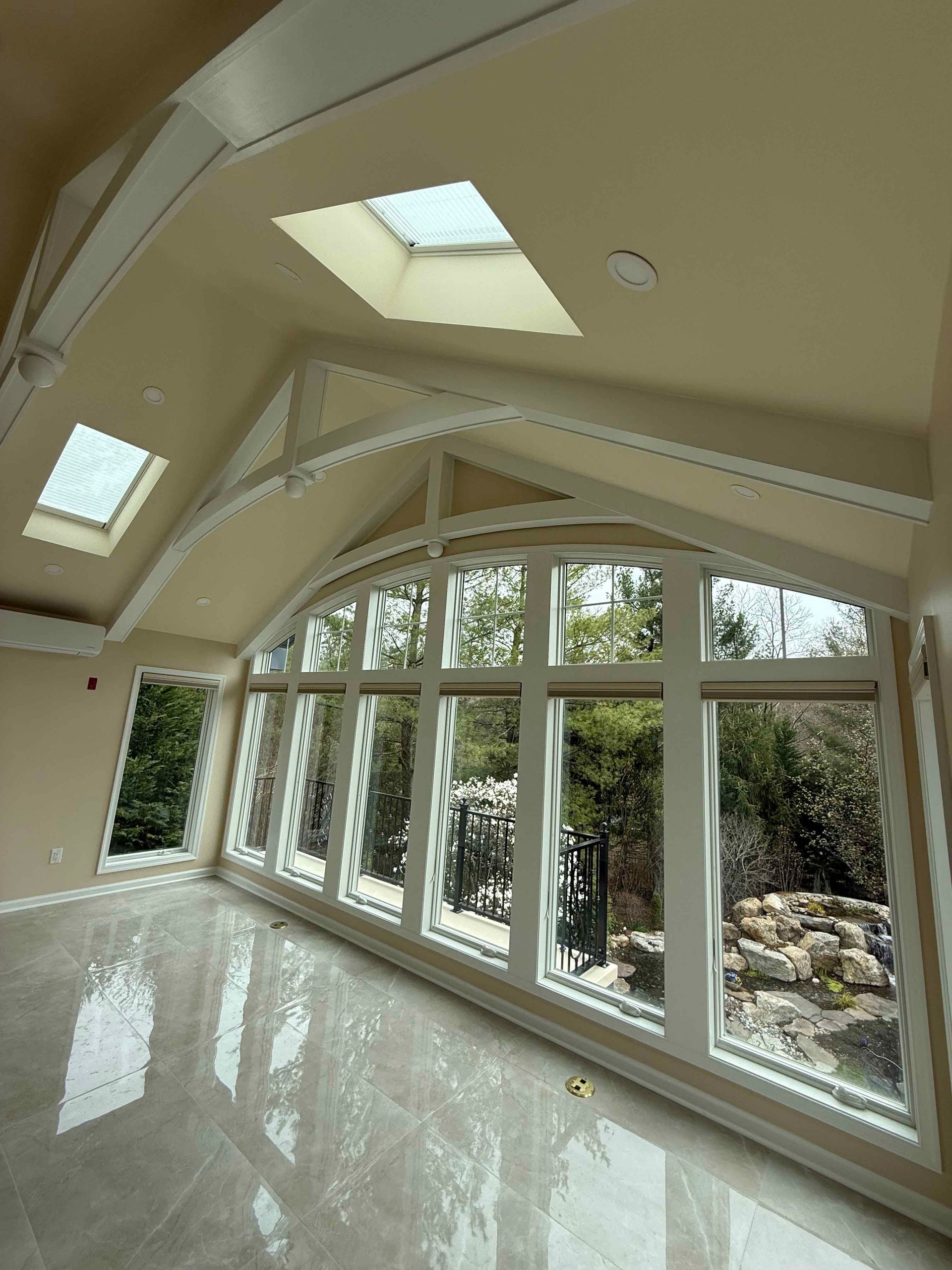 A room with a lot of windows and a skylight