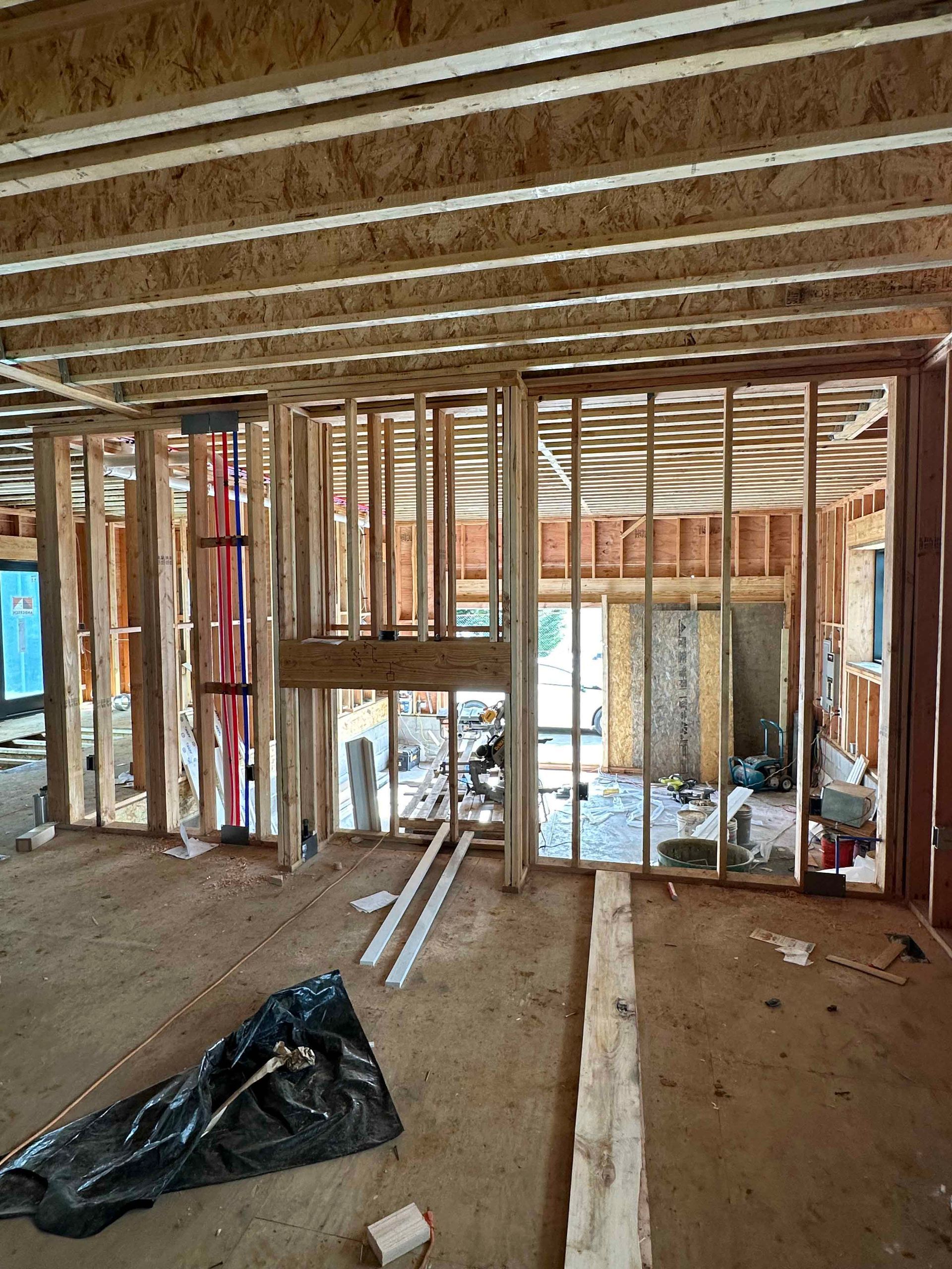 A house is being built with a lot of wooden beams.