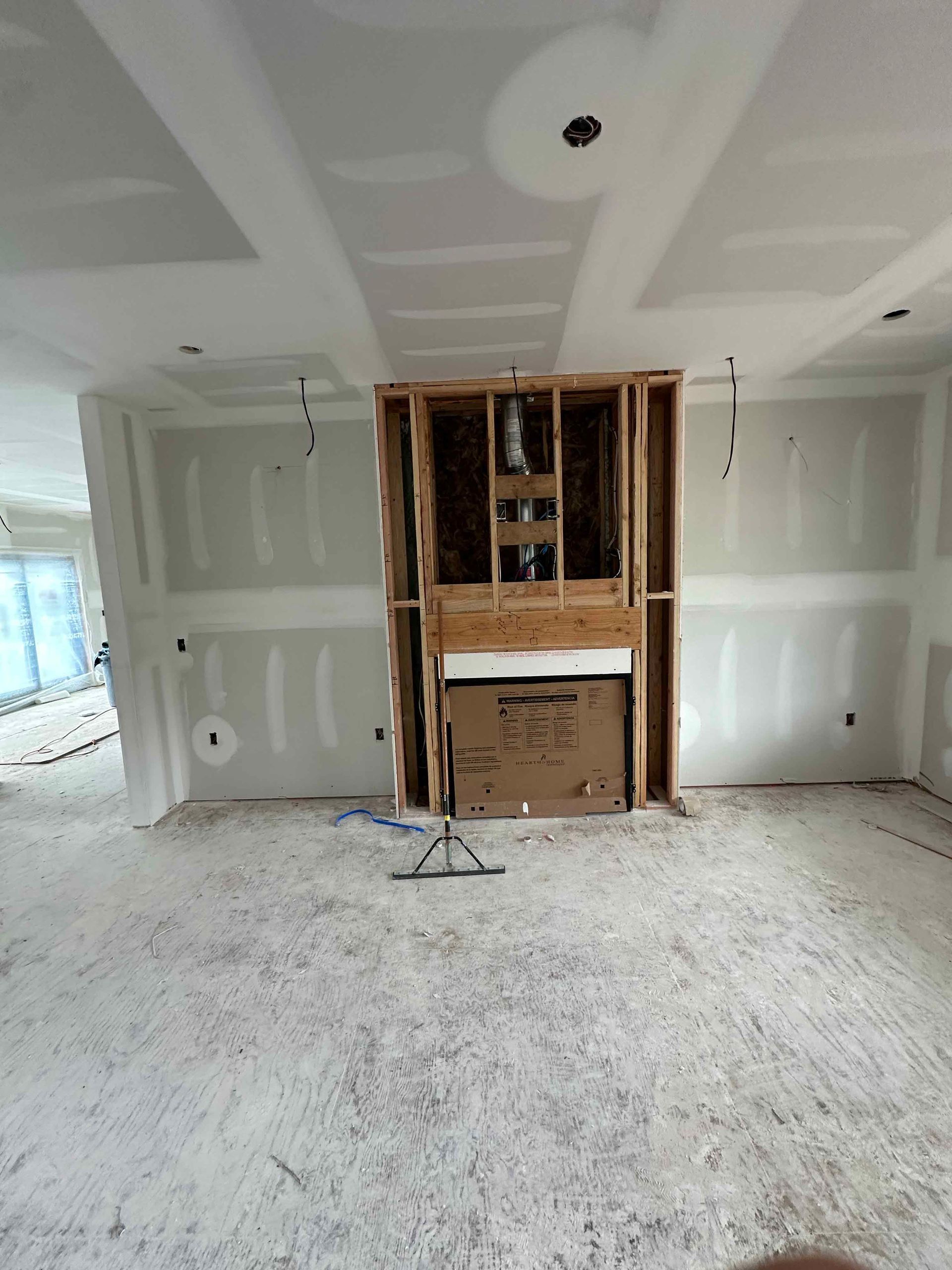 There is a fireplace in the middle of the room.