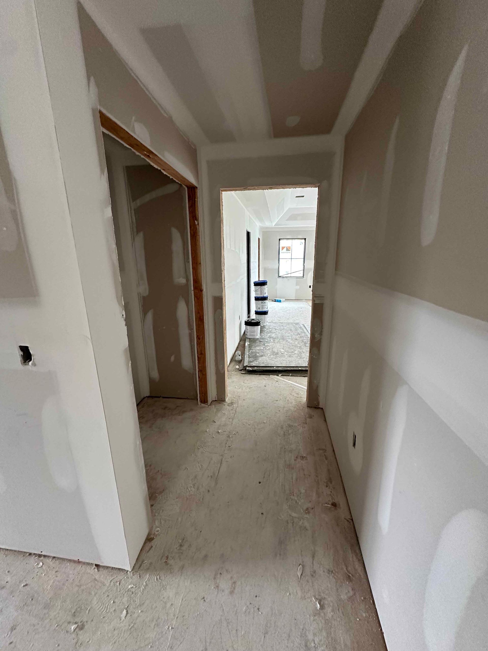 A hallway in a house that is being remodeled.