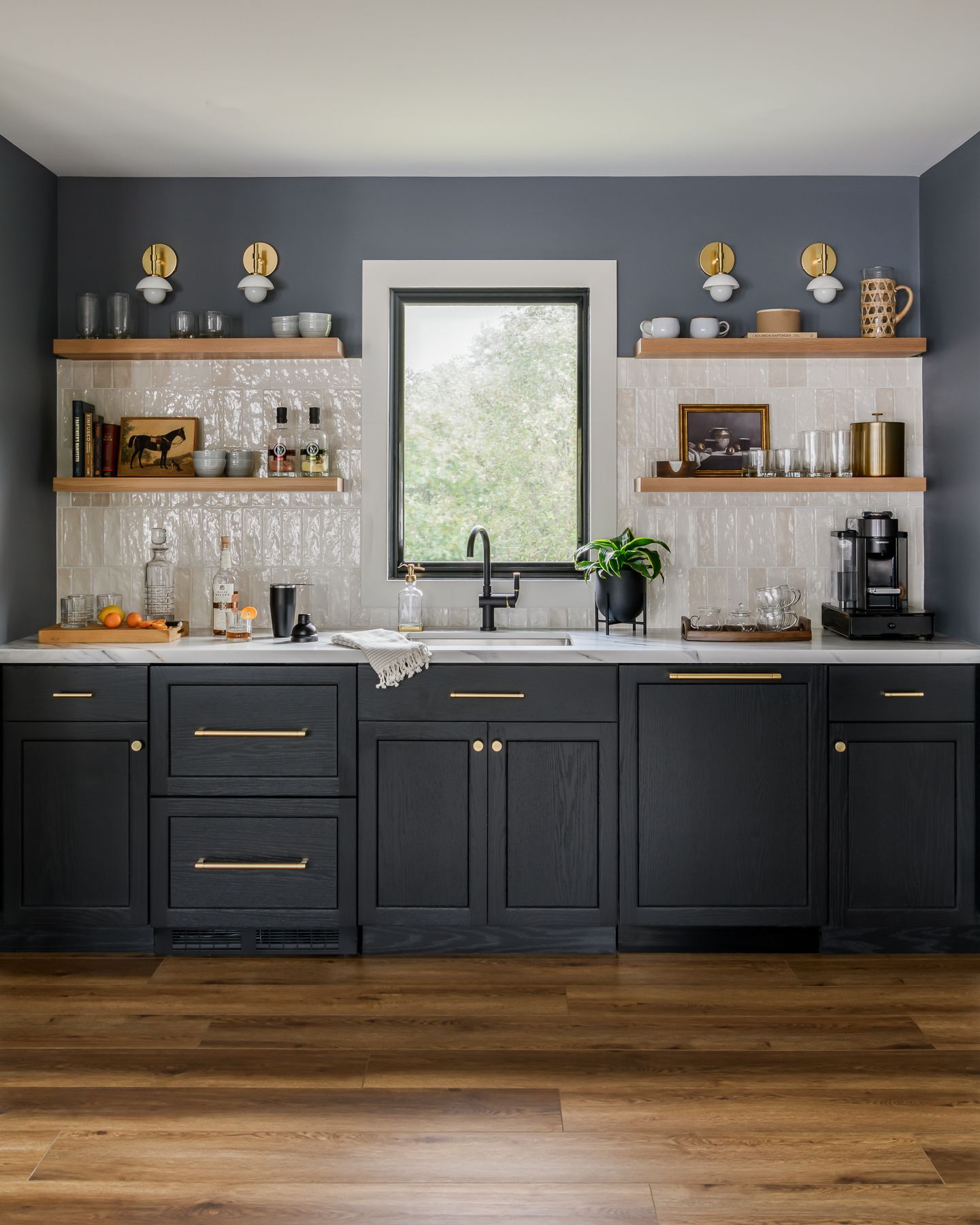 kitchen with dark blue cabinets, white countertops, and wooden shelves