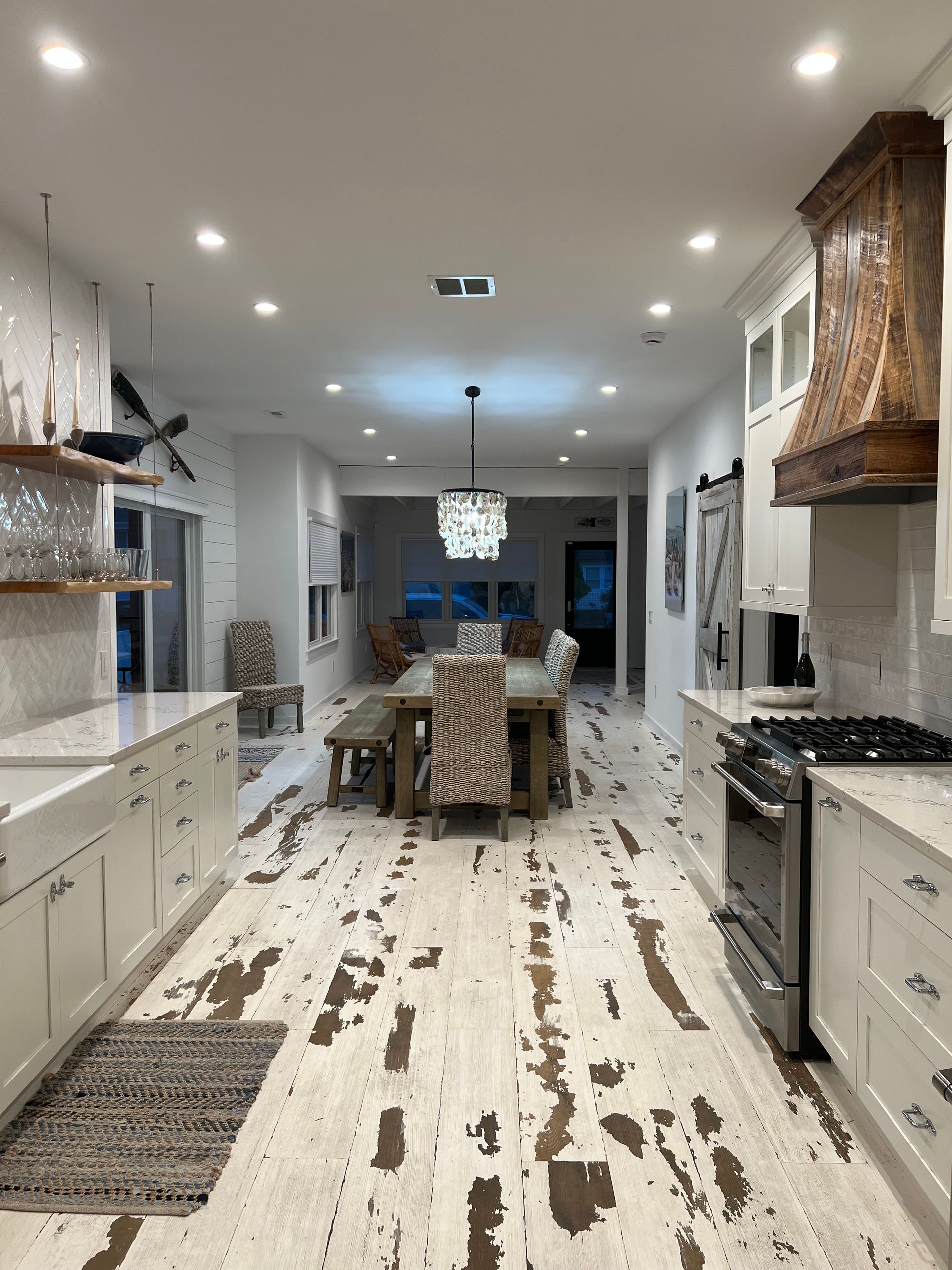 A kitchen with a table and chairs in it