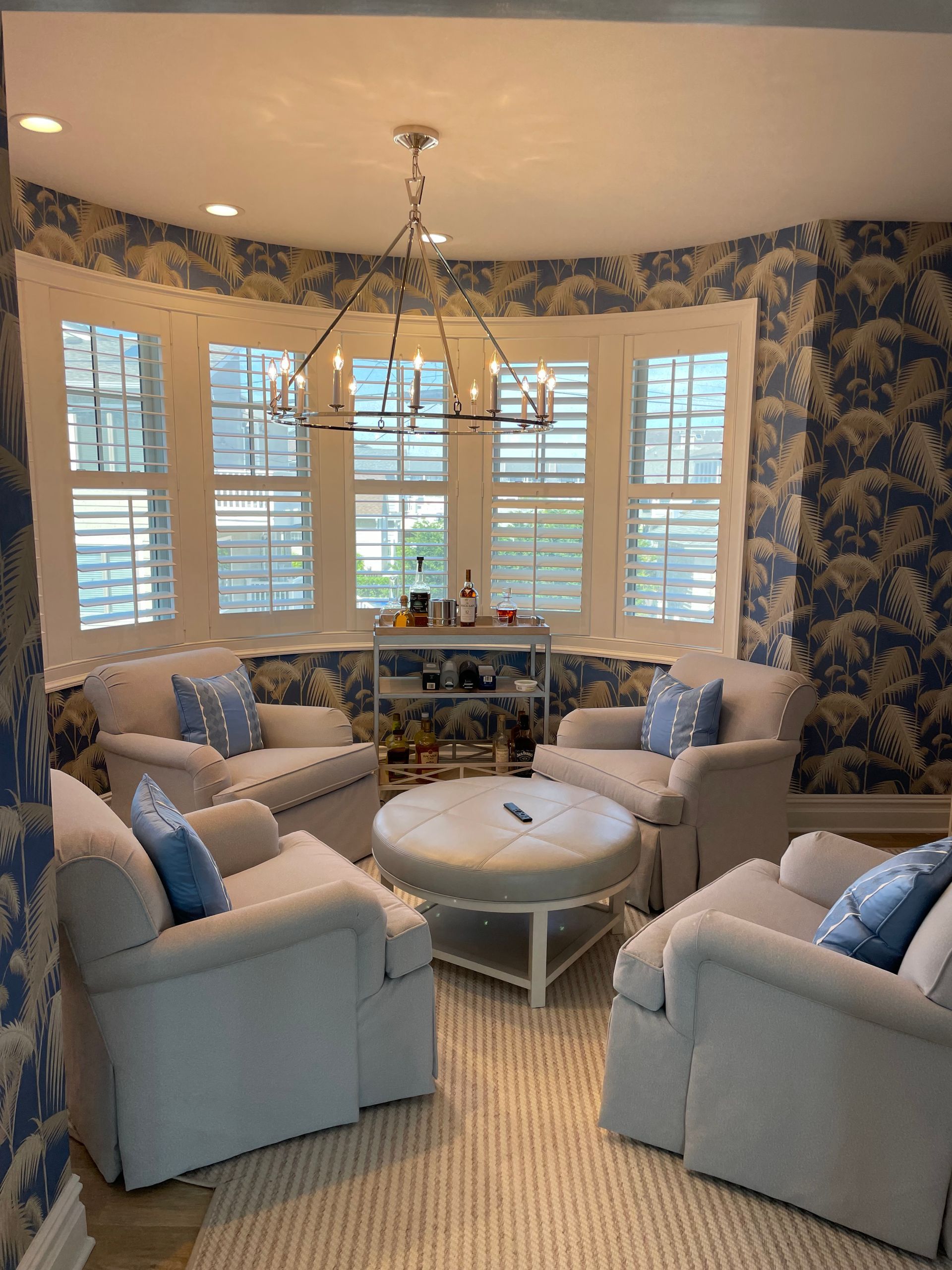 A living room filled with furniture and a chandelier.