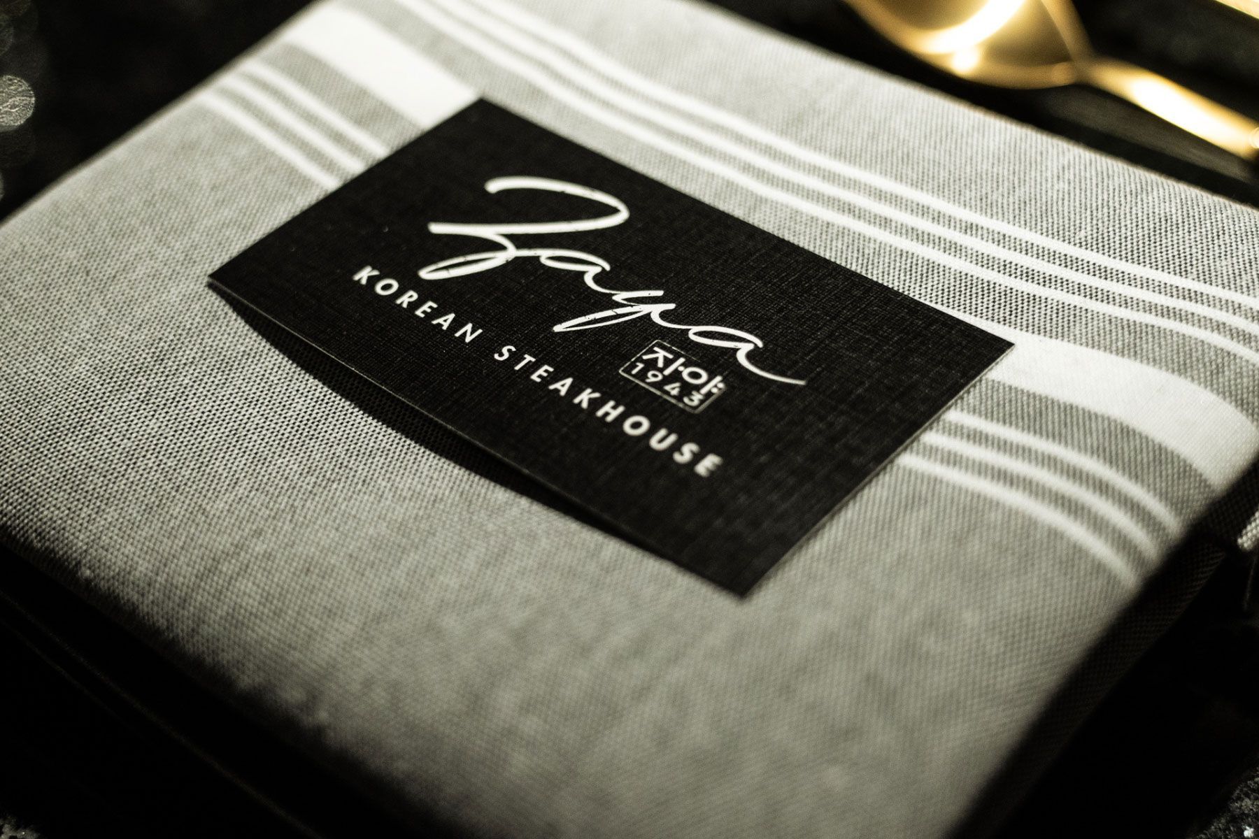 A napkin with a label that says korean steakhouse on it