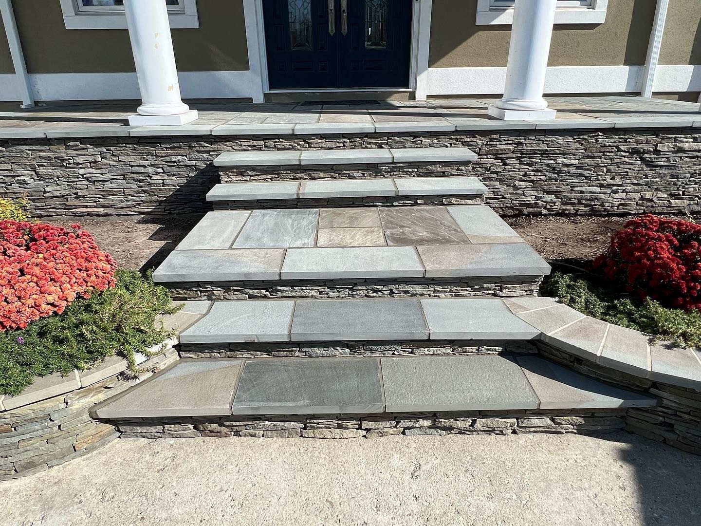 a set of stone steps leading up to a house