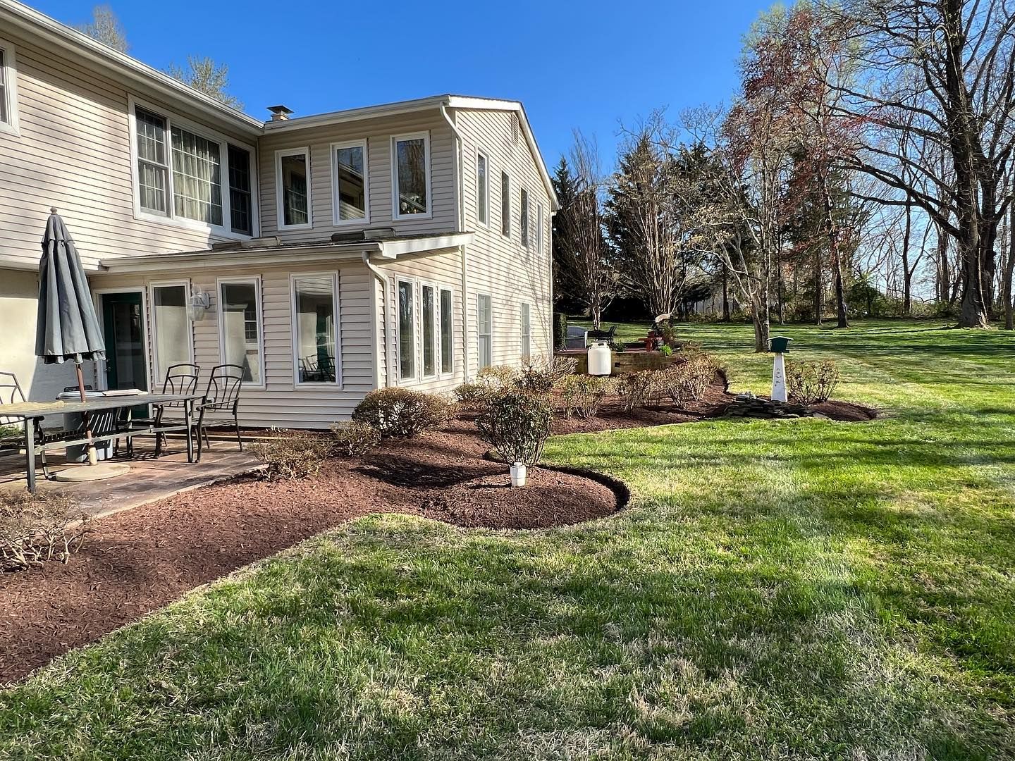 a large house with a large lawn in front of it .