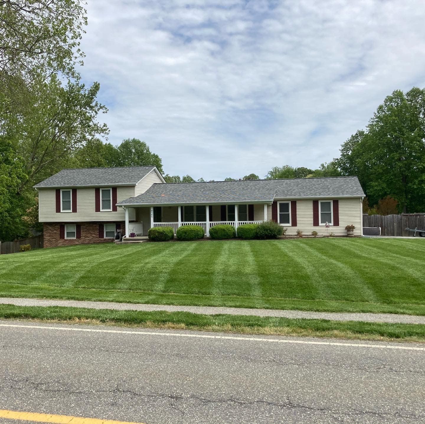 a house with a large lawn in front of it
