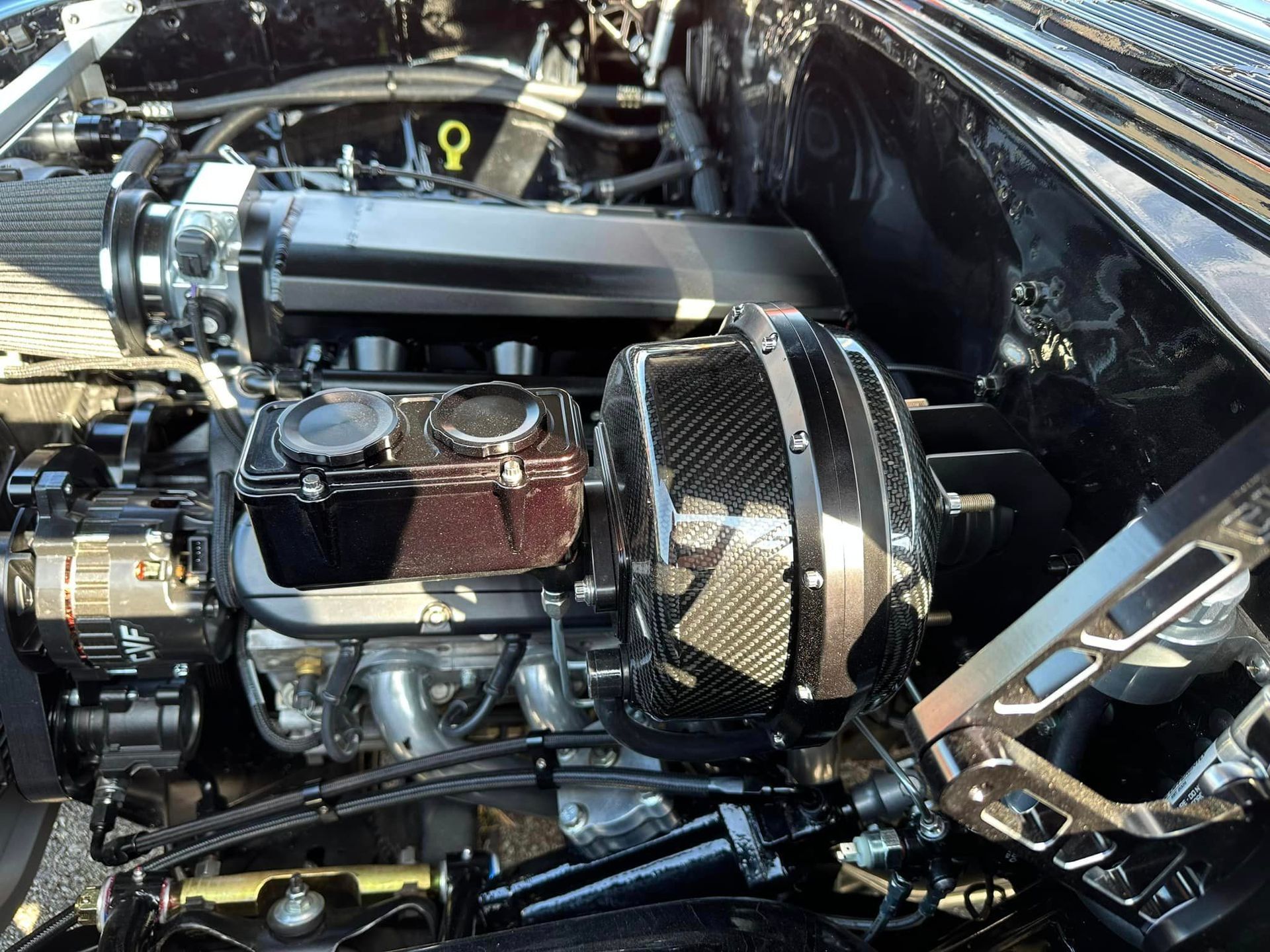 A close up of a car engine with the number 9 on it