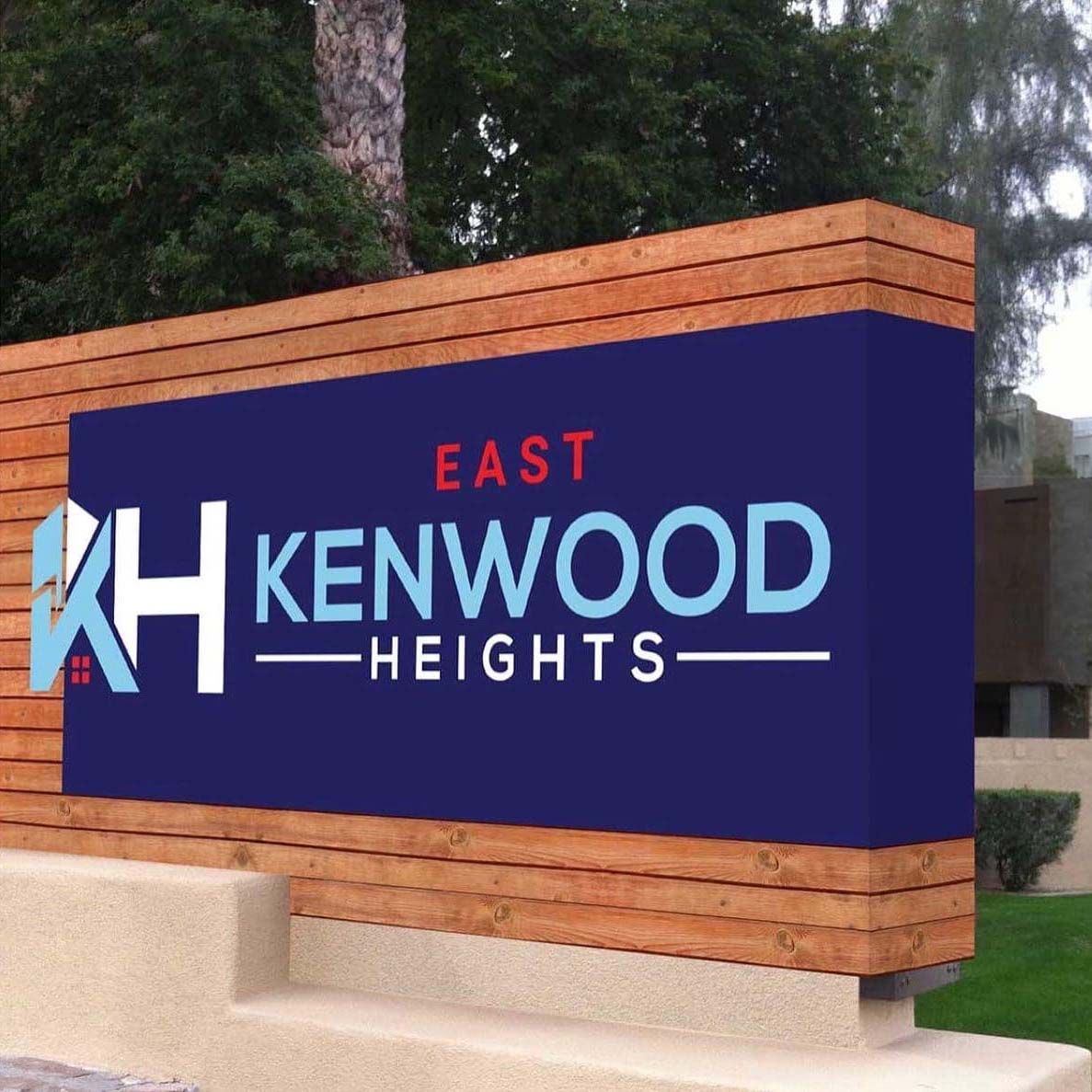 East Kenwood Heights sign in blue and orange masonry at an outdoor entrance
