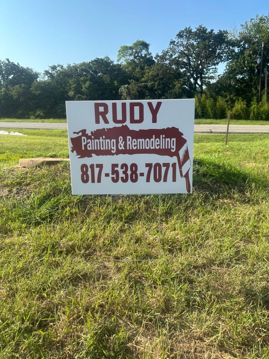 RUDY Painting & Remodeling sign with phone number 817-538-7071 on a grassy roadside