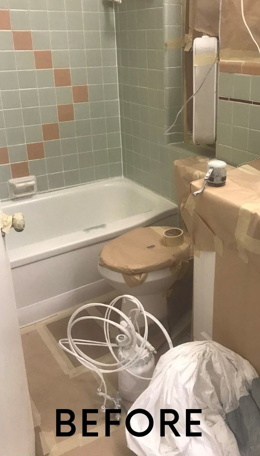 A before picture of a bathroom with a tub, toilet, sink, and mirror.
