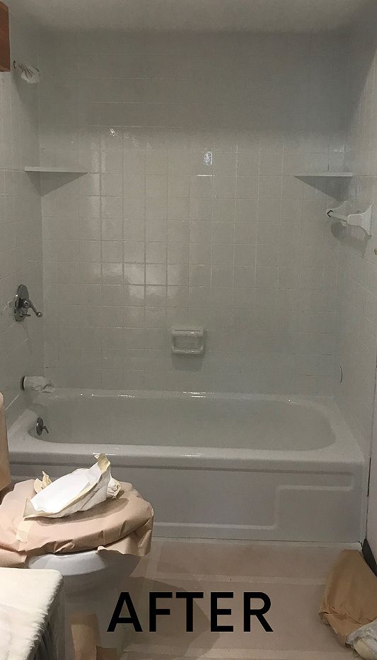 A bathroom with a bathtub and shower after being remodeled.