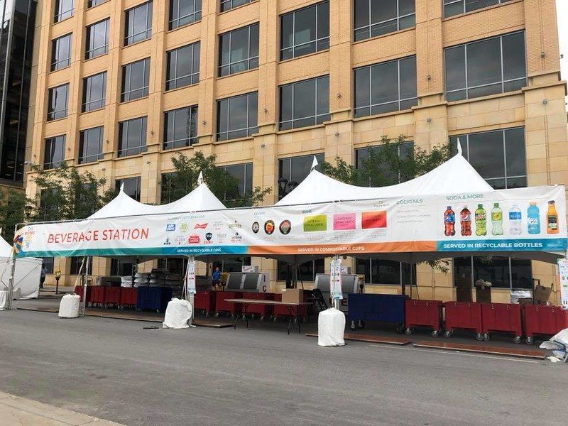 A long white tent labeled 