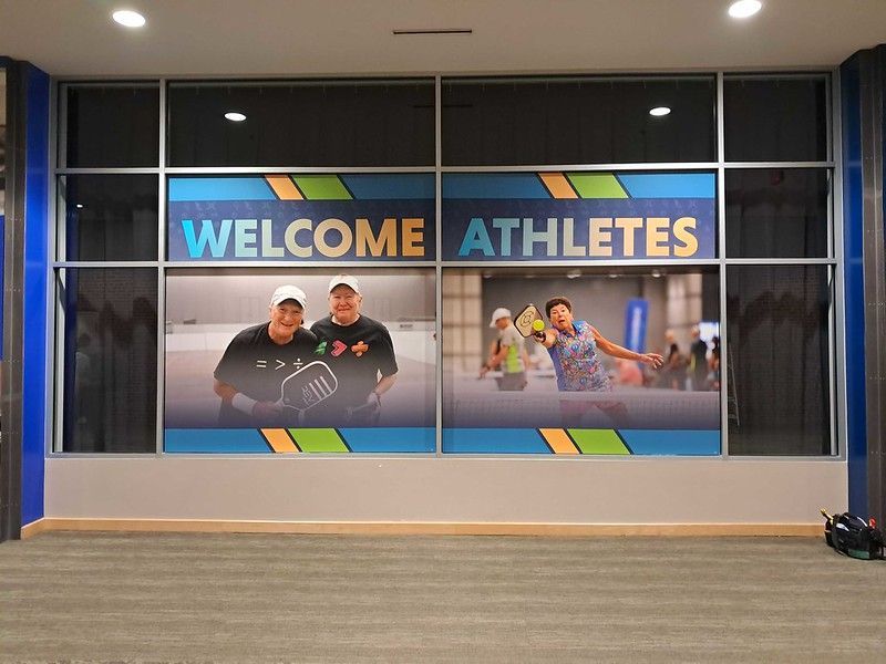 A glass wall decorated with a 