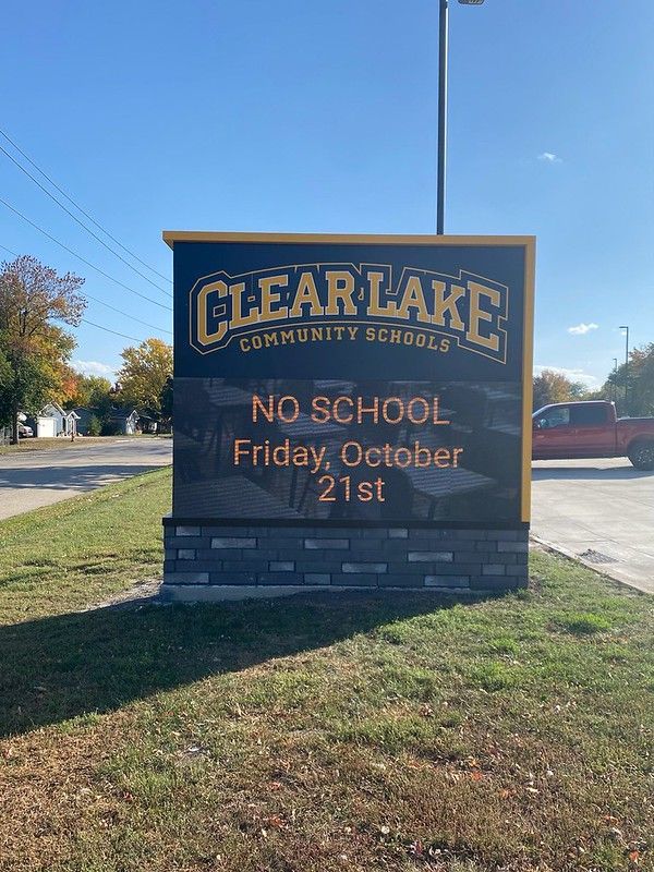 A Clear Lake Community Schools sign on a sunny day stating, 
