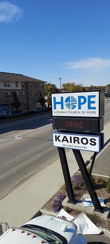 A street-level sign for 