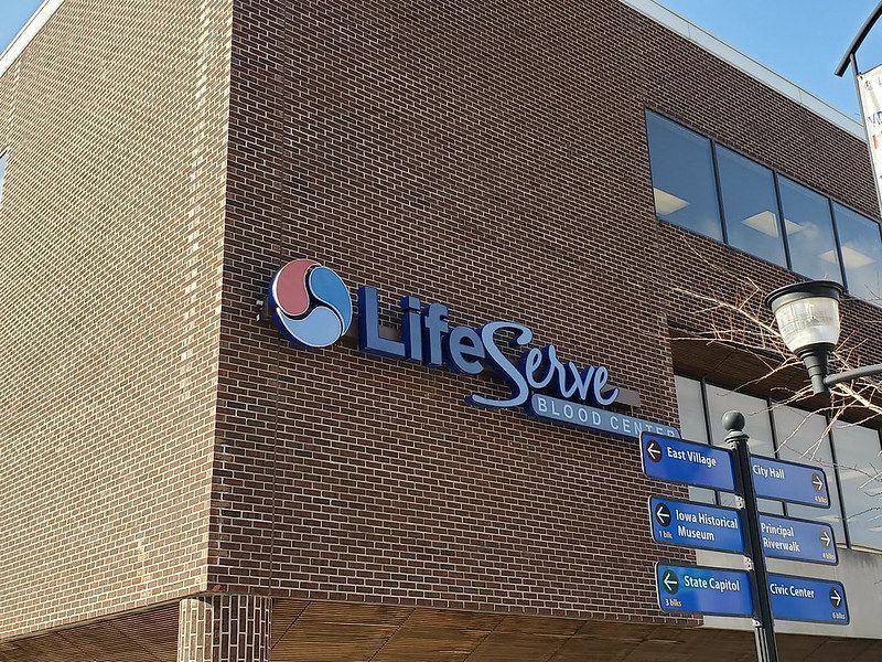 A brick building with a blue 