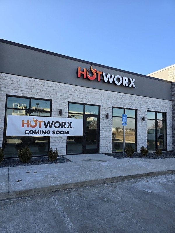 A stone-facade building storefront with a 