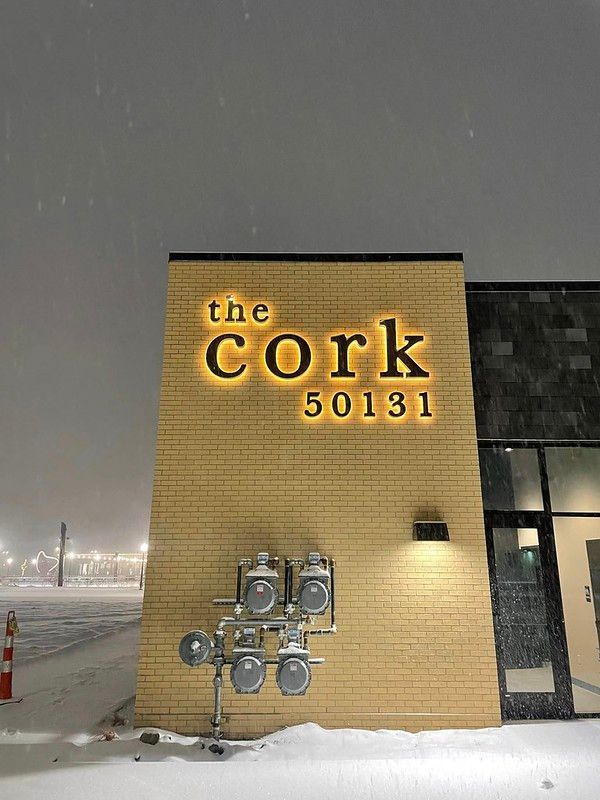 An illuminated sign reads 