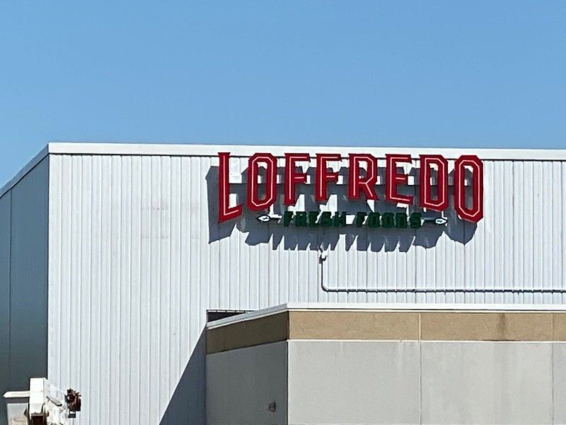 A large red sign reading 