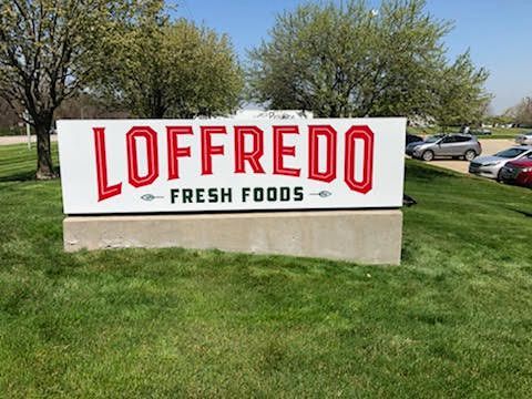 A white sign reading 