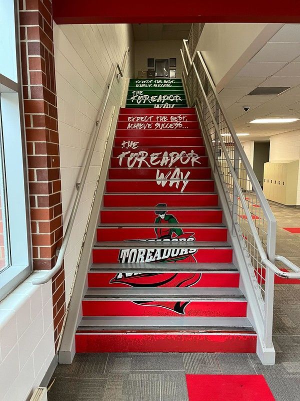 Red staircase inside a building with 