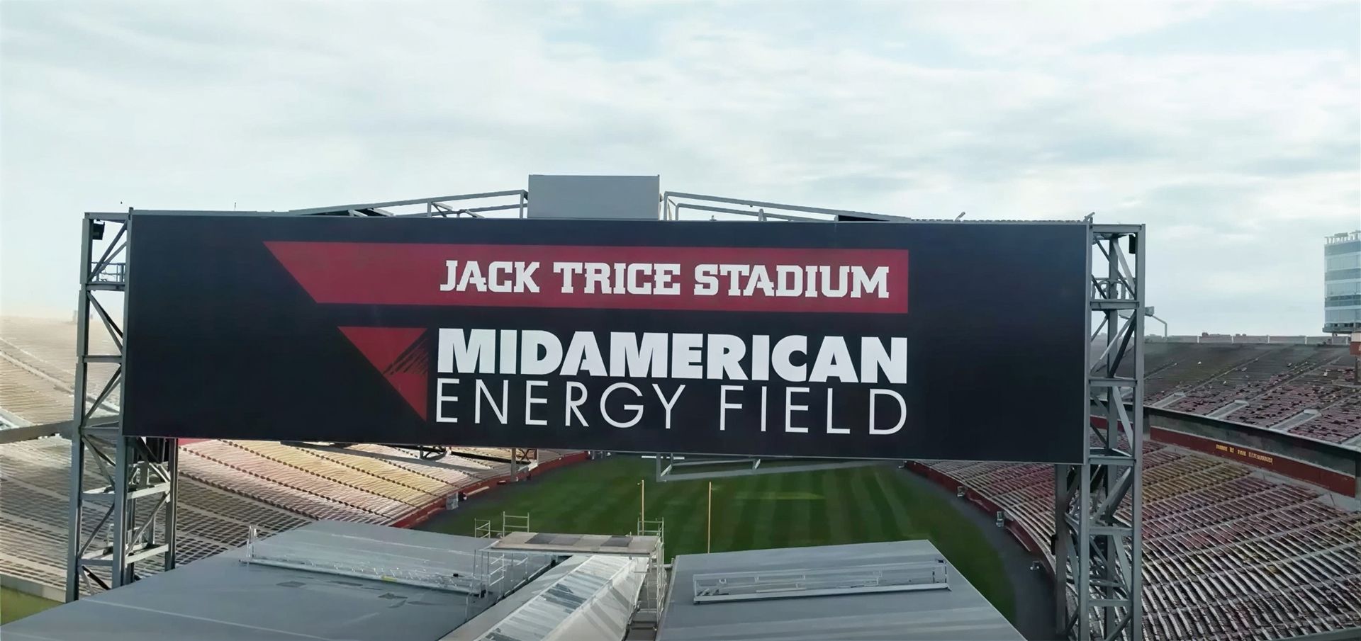 Sign for Jack Trice Stadium at MidAmerican Energy Field against a cloudy sky.