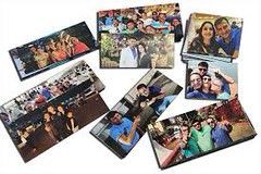 A collection of rectangular photo prints featuring groups and individuals, scattered on a white background.