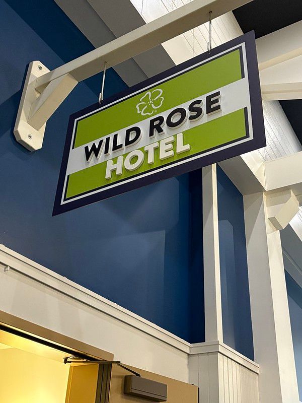 A rectangular sign reading 