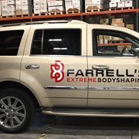A tan SUV parked indoors with the red and black logo for Farrell's Extreme Bodyshaping on the side door.