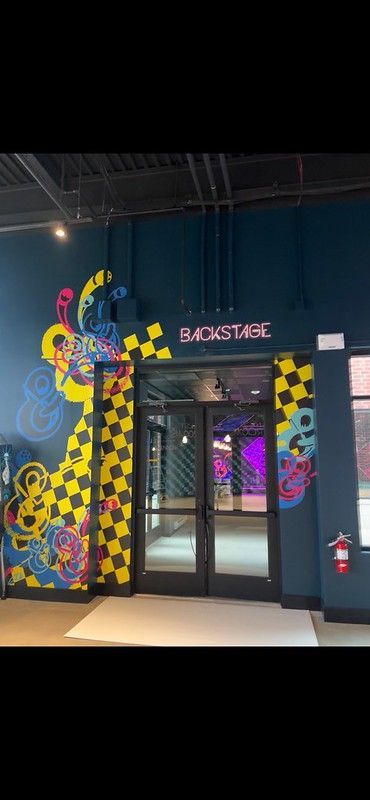 A double glass door entrance labeled 