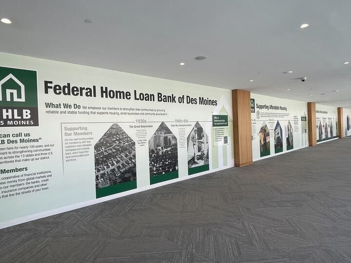 An interior wall mural at the Federal Home Loan Bank of Des Moines detailing the bank's history and mission.