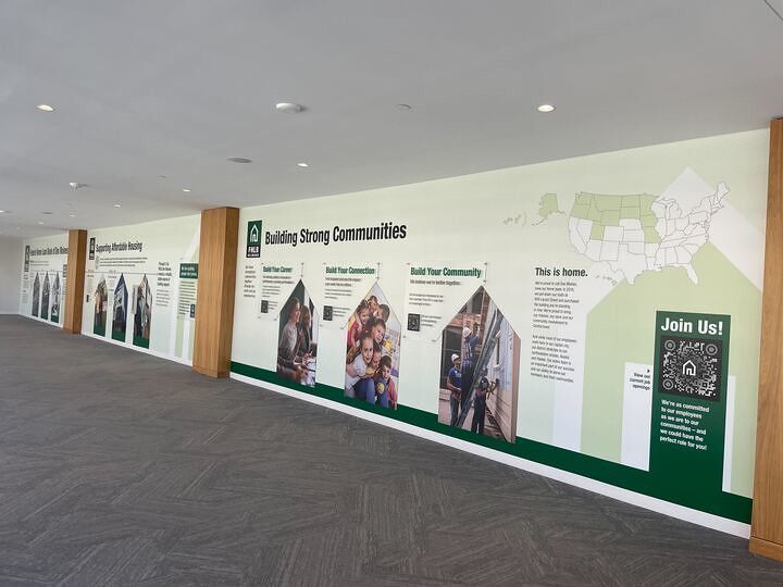 A long mural on a hallway wall titled 