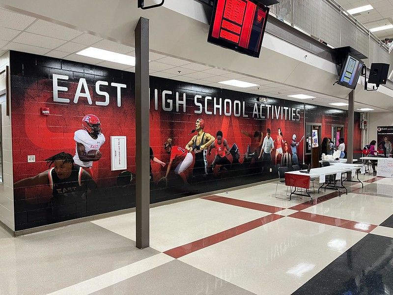 A large wall mural labeled 