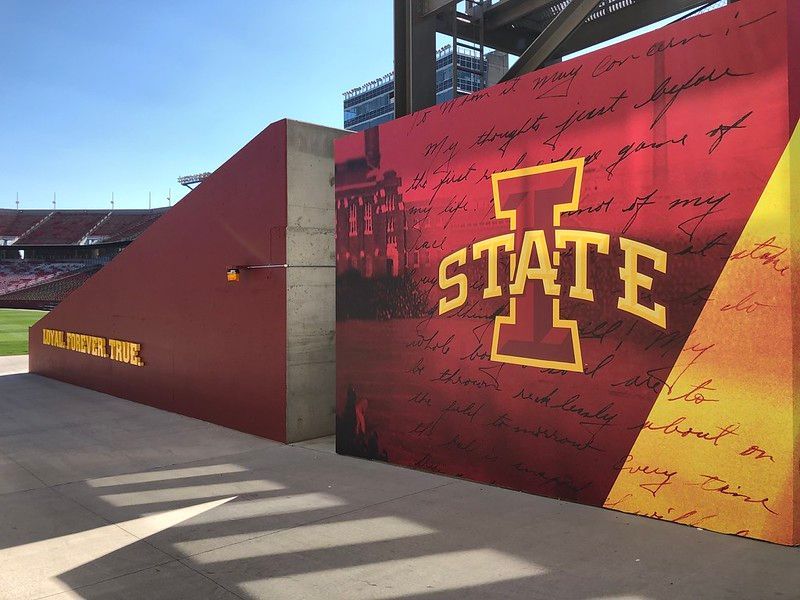 Iowa State University branding on a red stadium wall featuring the 