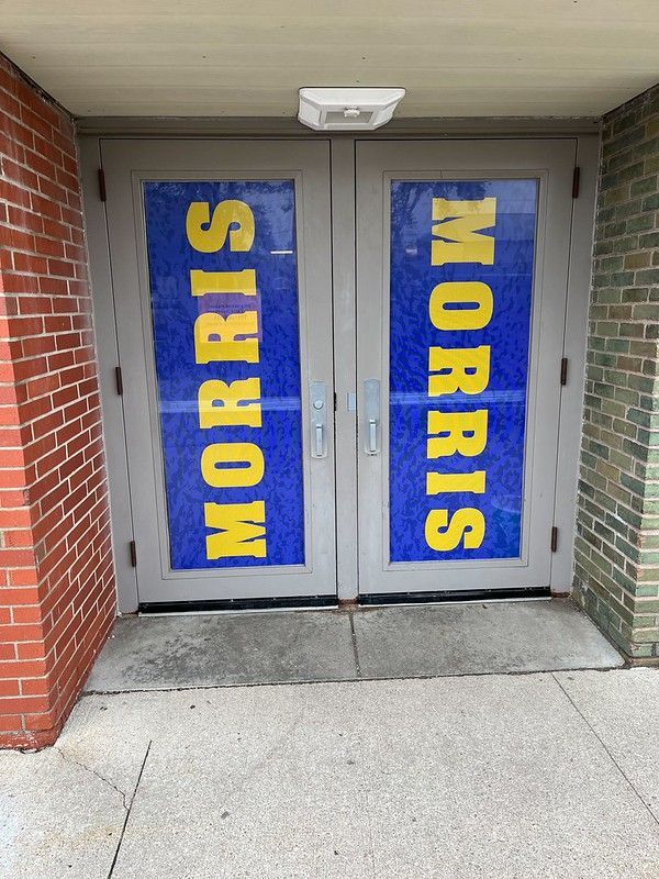 Double doors with blue panels featuring the yellow text 
