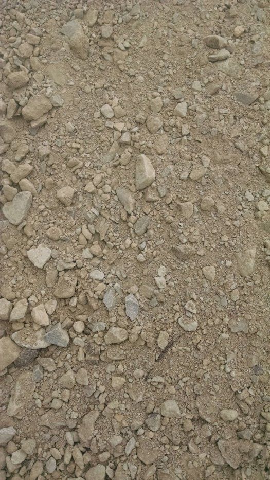 A pile of dirt and rocks on the ground.
