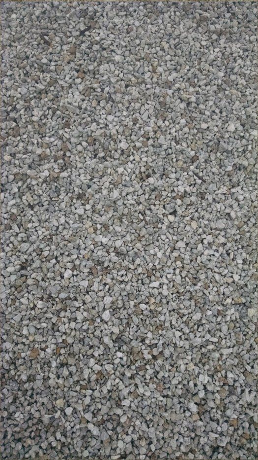 A pile of gravel is sitting on the ground.