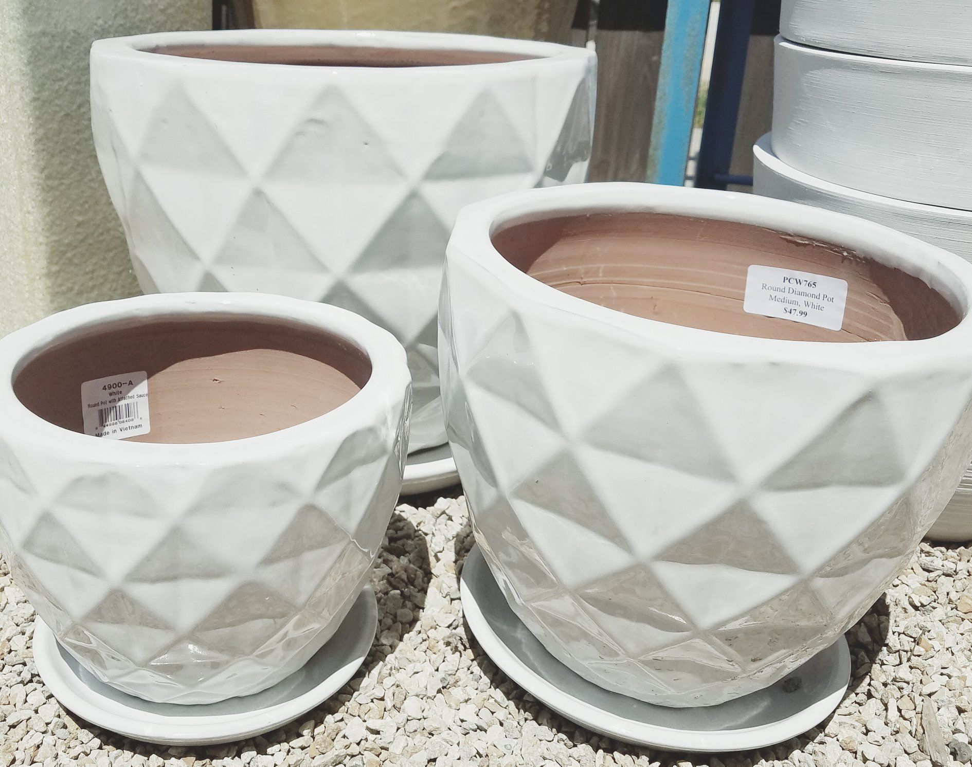 A group of white pots are sitting on a table