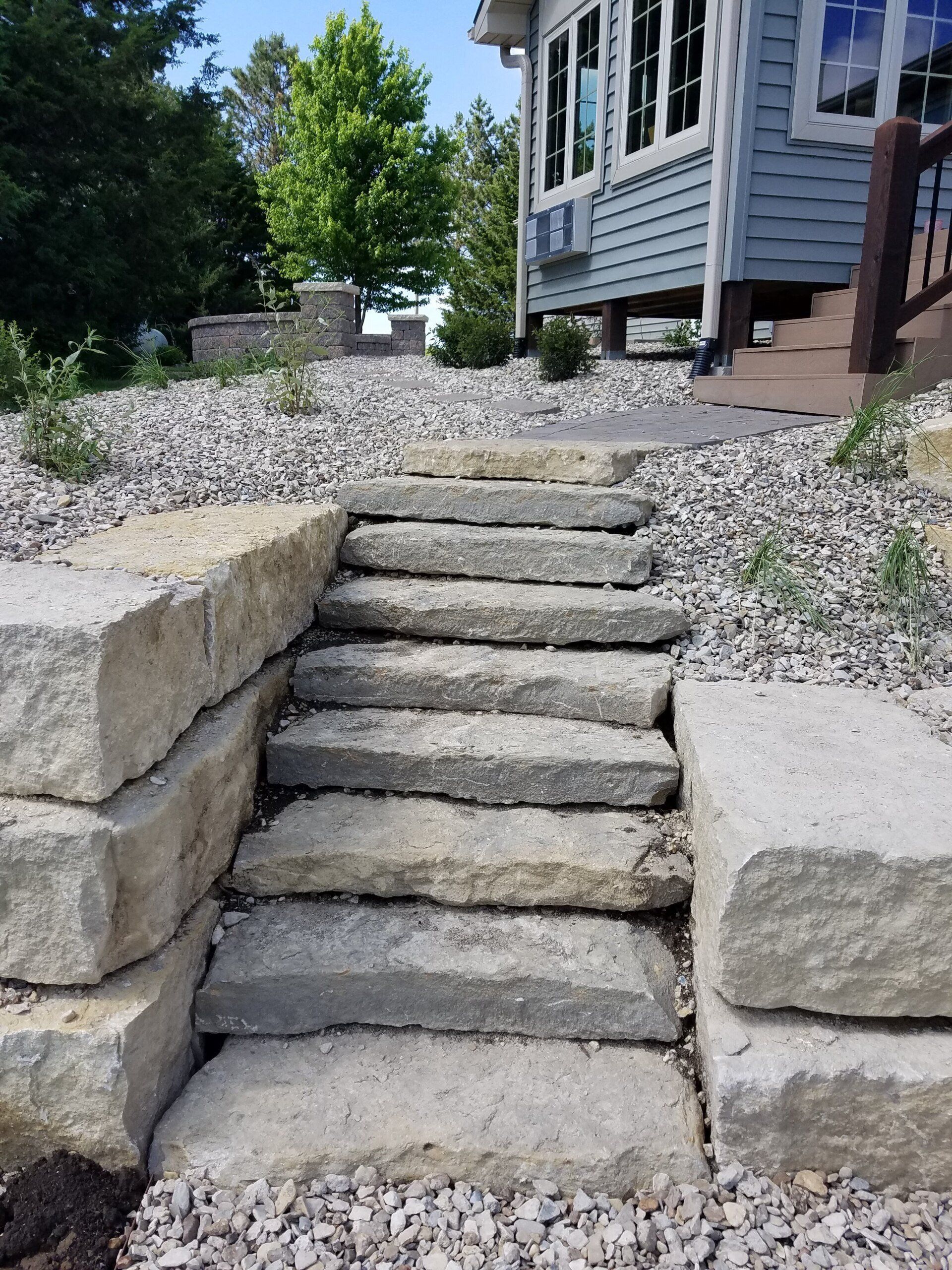 A set of stone steps leading up to a house