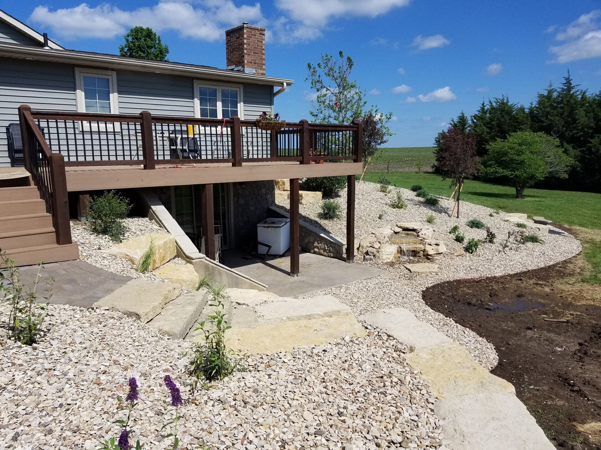 A house with a deck and stairs leading up to it