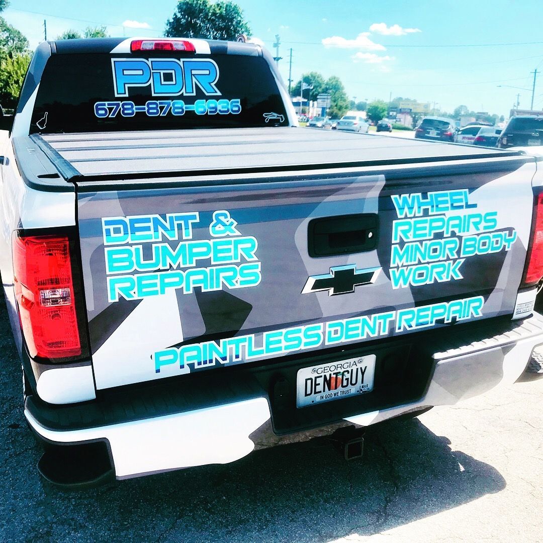 A truck that says PDR on the back of it