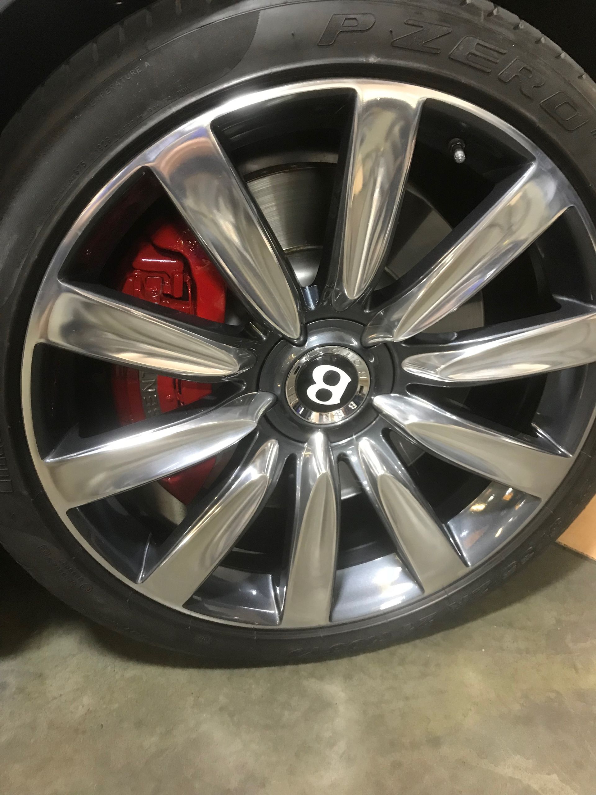 A Bentley wheel with the number 8 on it