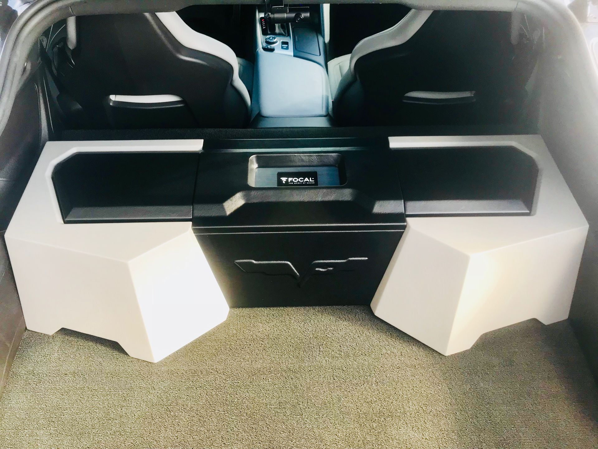 The trunk of a car has a speaker in it